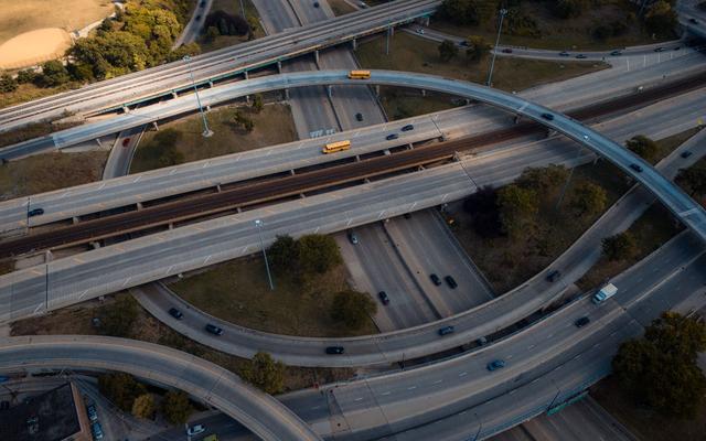 Aerial view of a highway interchange and its curving ramps